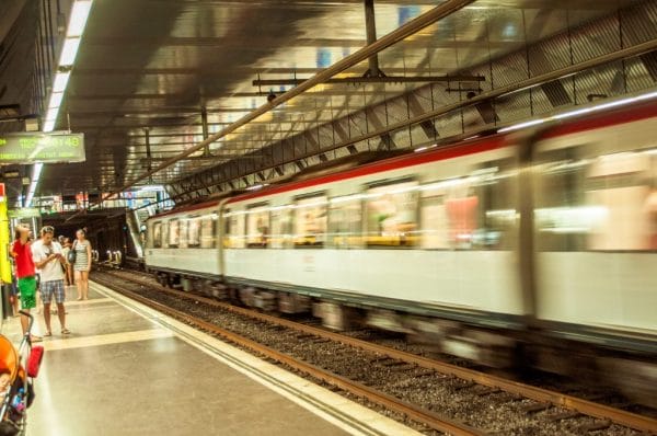 blurred speeding train image photo by Carissa Rogers