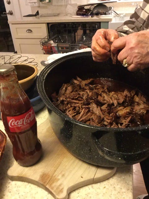 This BBQ Pulled Beef recipe is amazing. Just get in there and use your hands!