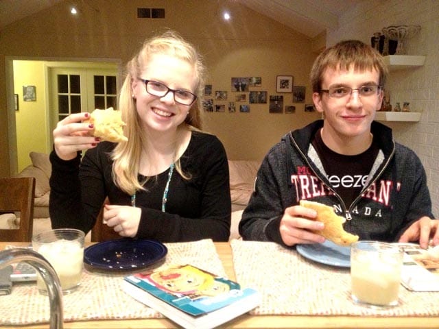 My twins enjoying a quick bite at the kitchen counter.