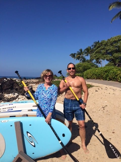 triathlete vacation paddle boarding on hawaii