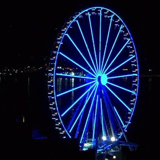 taking a ride on the ferris wheel when exploring Seattle